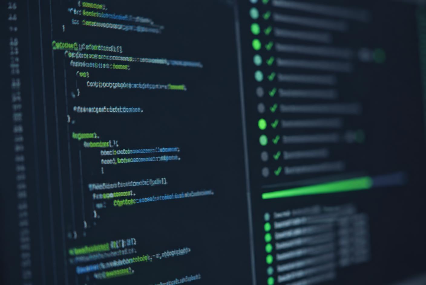 Close-up of a developer screen showing source code beside a passing automated test run